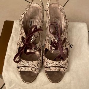 Milano Blahnik‘s Snakeskin laced heels